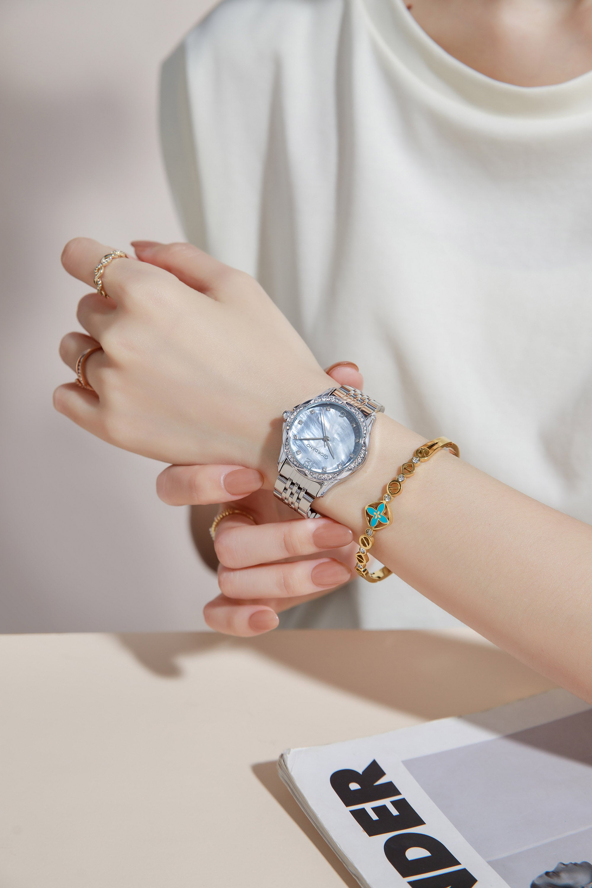 Giordano Analog Quartz Watch for Women with Textured Round Brown Dial, Flower shape case, Blue Crown, Crystal studded hour markers and bezel, Silver Stainless Steel Strap - GZ-60157-22