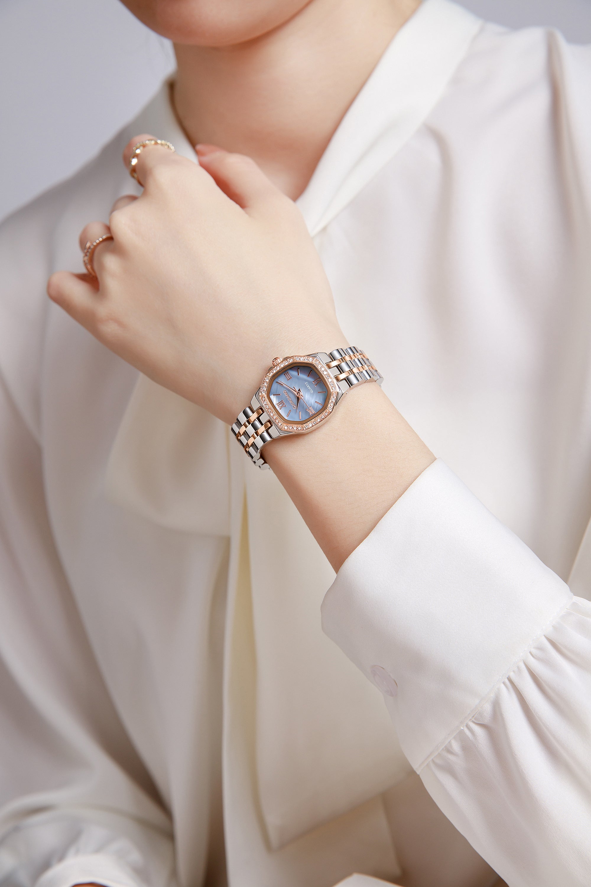 Giordano Analog Quartz Watch for Women with Round Blue Dial, Crystal Studded Bezel, Roman Markers and Stainless Steel Strap - GZ-60162-55