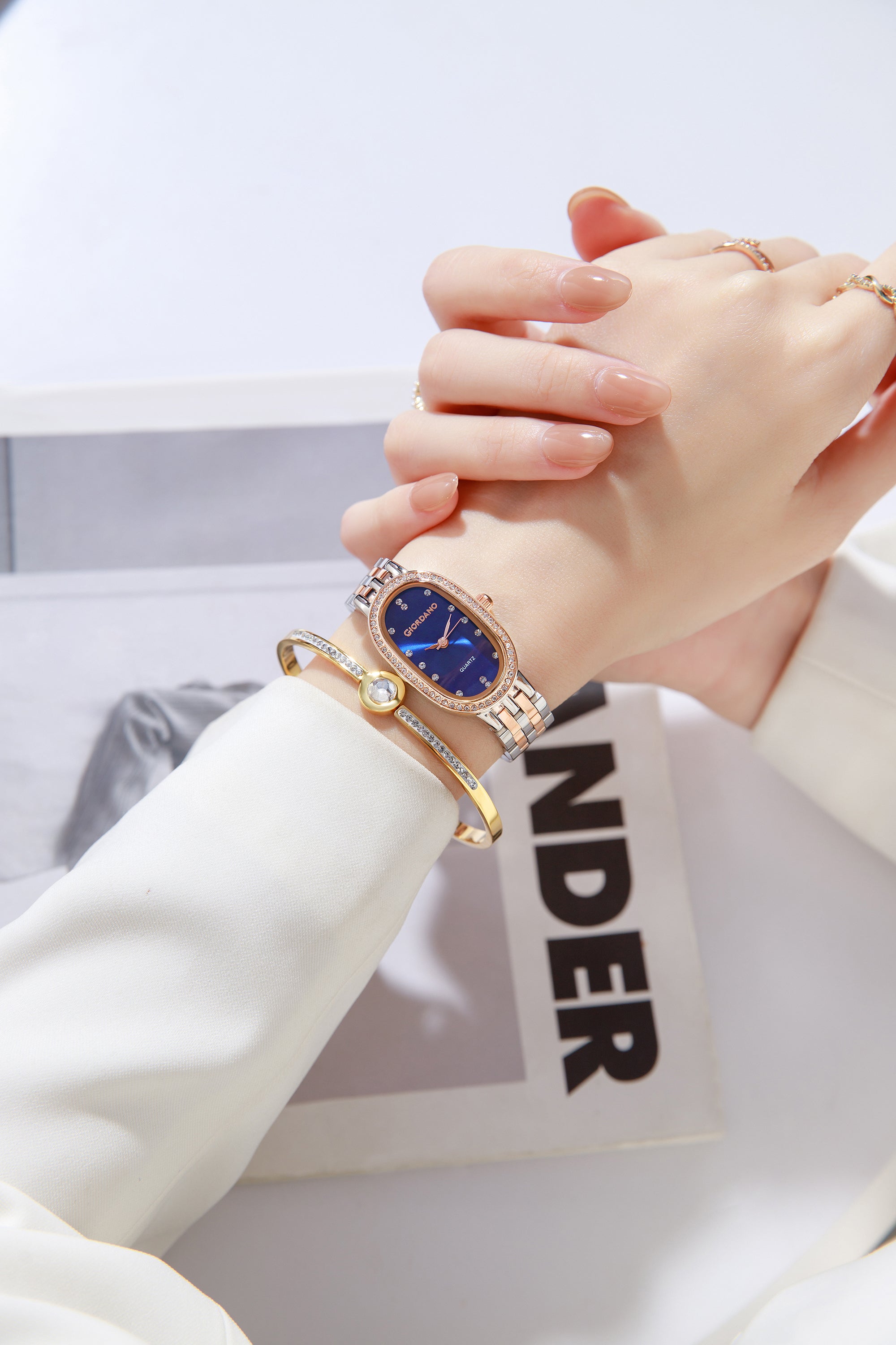 Giordano Analog Quartz Watch for Women with Bangle Oval Blue Dial, Blue Crown, Crystal Studded Hour Markers and Bezel, Silver and Rose Gold Stainless Steel Strap - GZ-60153-44