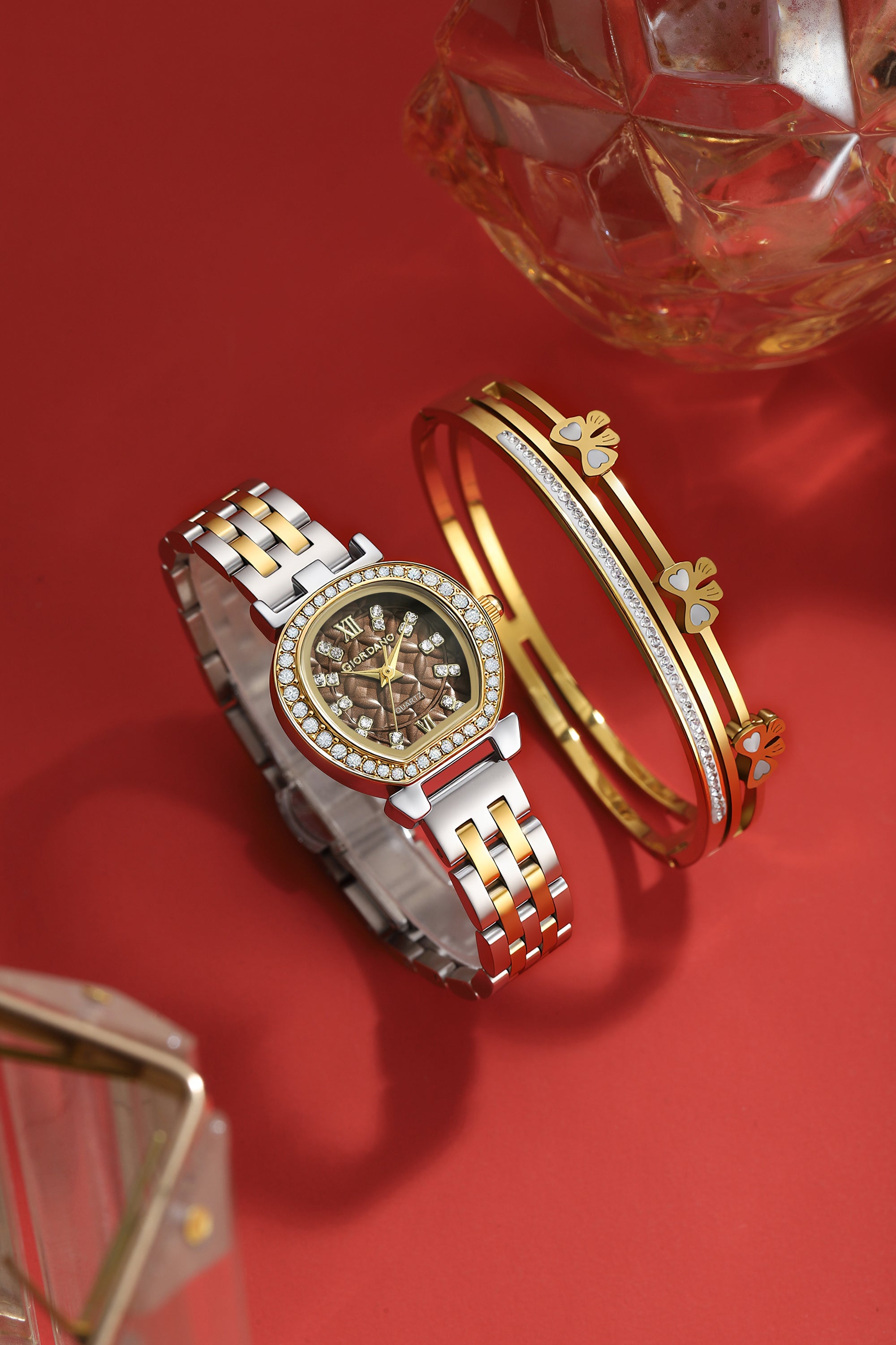 Giordano Analog Quartz Watch for Women with Bangle Set Texured Oval Brown Dial, Roman Indices, Blue Crown, Crystal Studded Hour Markers and Bezel, Silver and Gold Stainless Steel Strap - GZ-60154-33