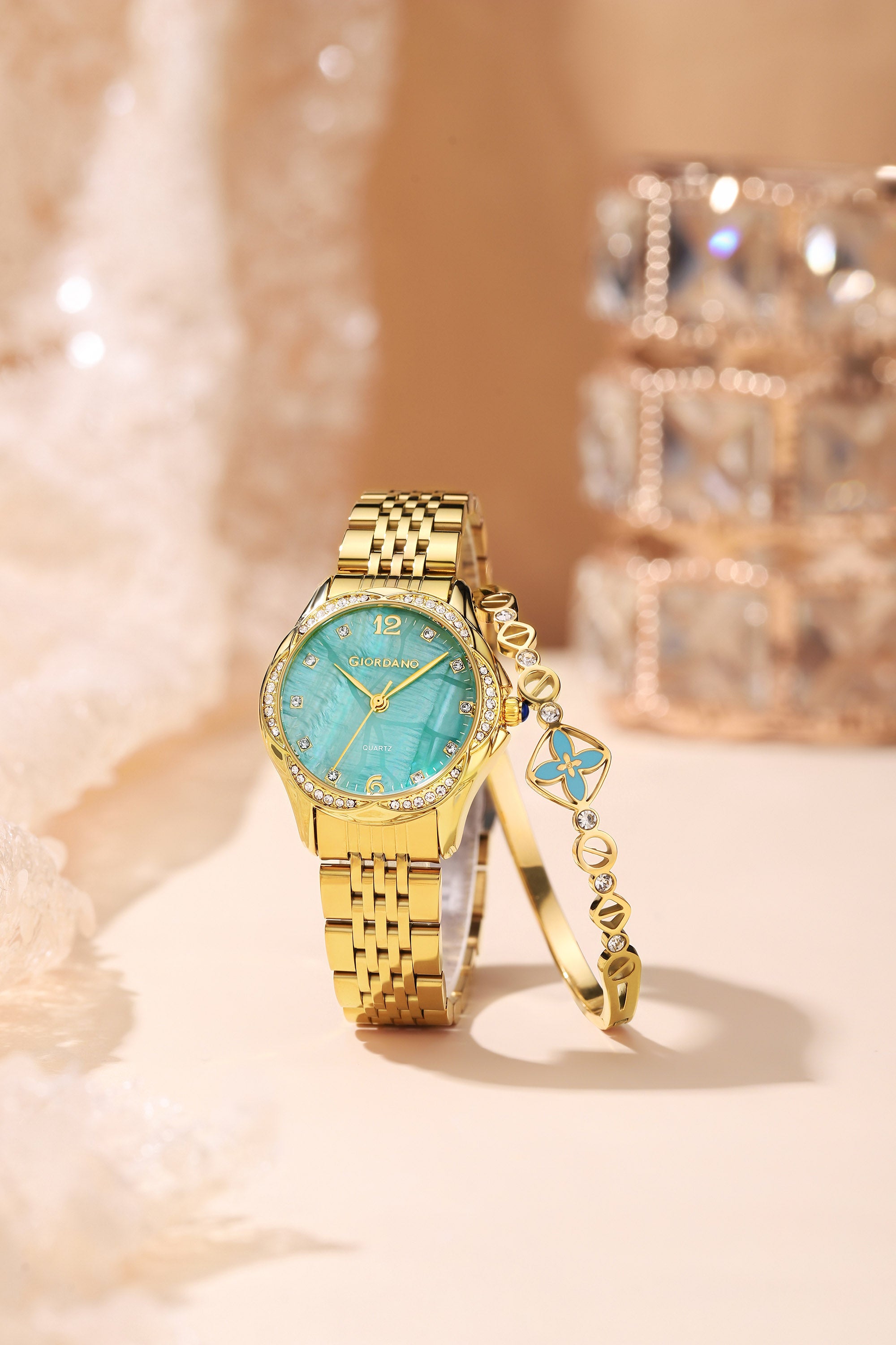 Giordano Analog Quartz Watch for Women with Textured Round Green Dial, Flower shape case, Blue Crown, Crystal studded hour markers and bezel, Gold Stainless Steel Strap - GZ-60157-33