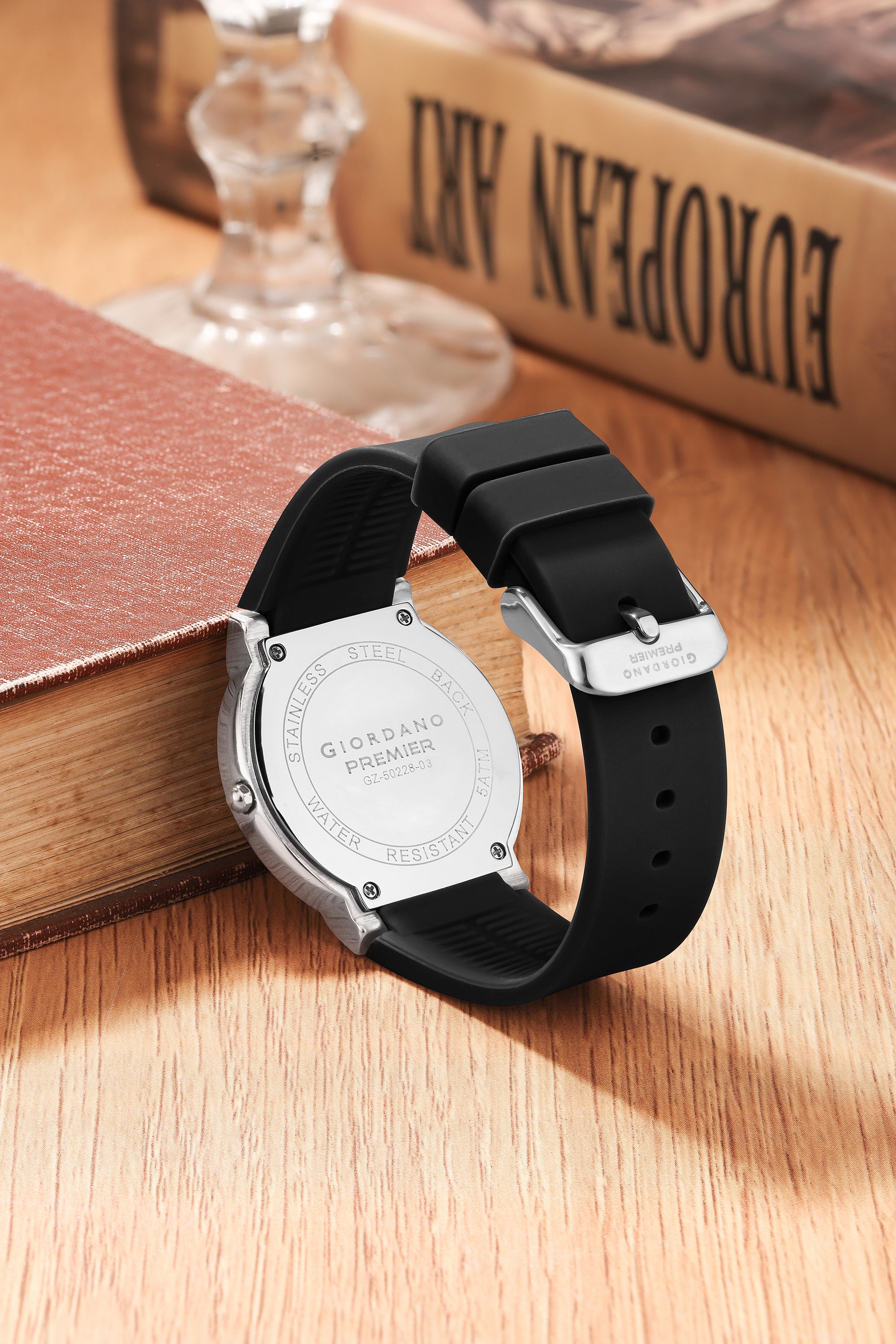 Giordano Premier Analog Quartz Watch for Women with Round Black Dial, Crystal Studded Bezel, Date Display, Silver Case & Black Silicone Strap - GZ-50228-01